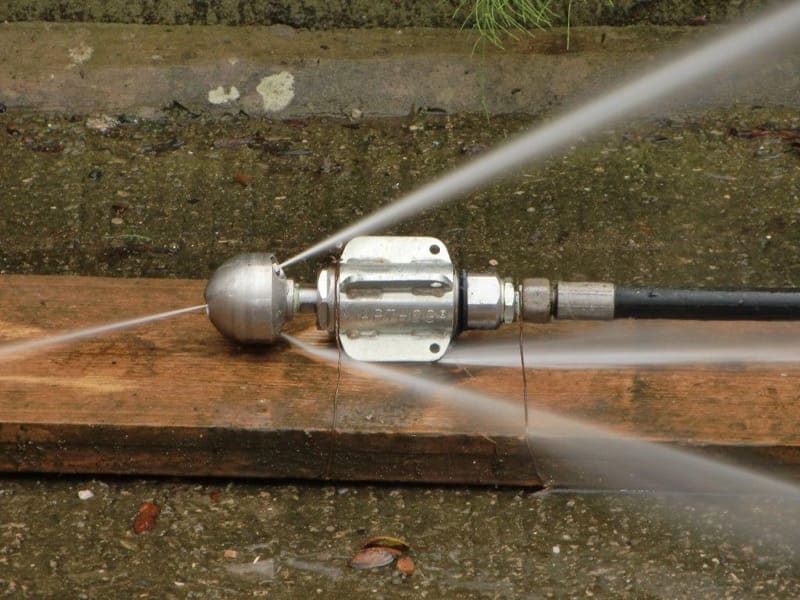 Water jet unblocking mechanism